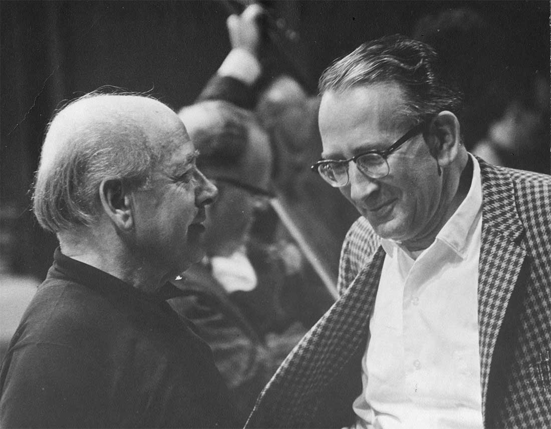Eugene Ormandy, the Music Director of the Philadelphia Orchestra at the left speaking with Werner during a rehearsal